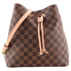 Embrace your modern elegance with the Louis Vuitton Neo Noe MM bag. Wh