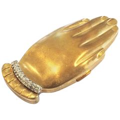Vintage Volupte Golden Gesture Figural compact with rhinestone bracelet