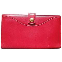 Vintage Christian Dior red genuine leather wallet with gold tone CD charm.