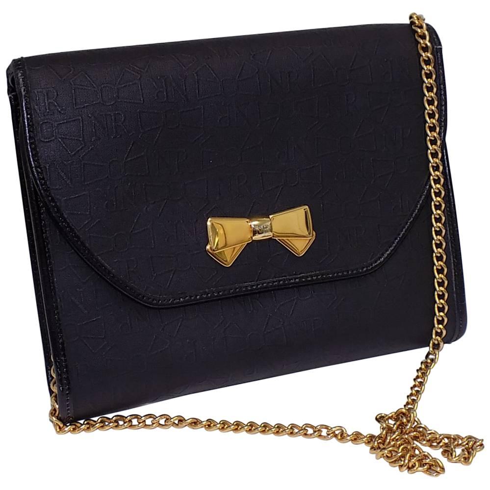 Nina Ricci black coated canvaswith gold chain bag / clutch For Sale