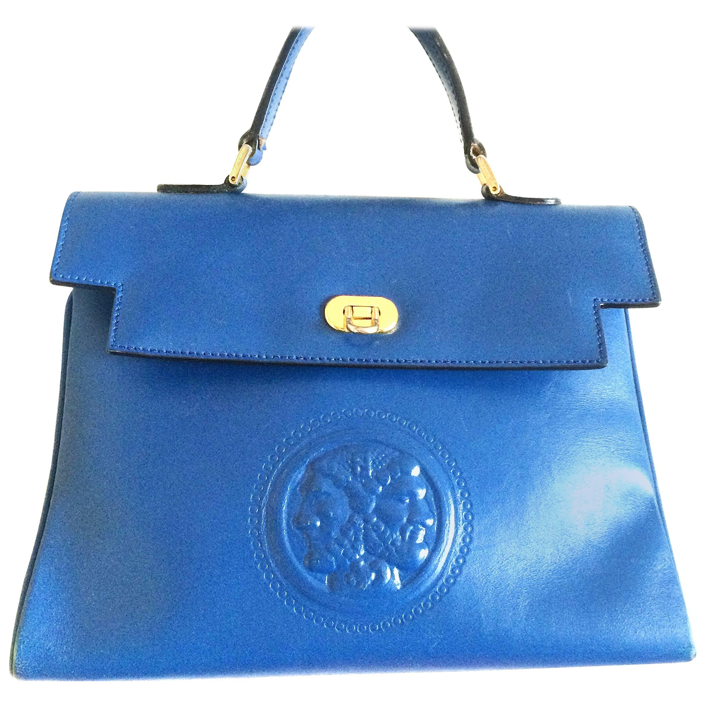 Vintage FENDI blue leather classic kelly style handbag with iconic Janus motif. For Sale
