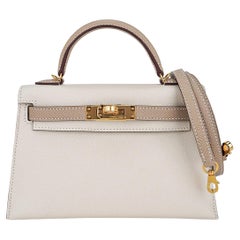 Hermès Kelly 20 Mini II Sellier Gris Perle Ostrich with Gold Hardware –  Bagsers