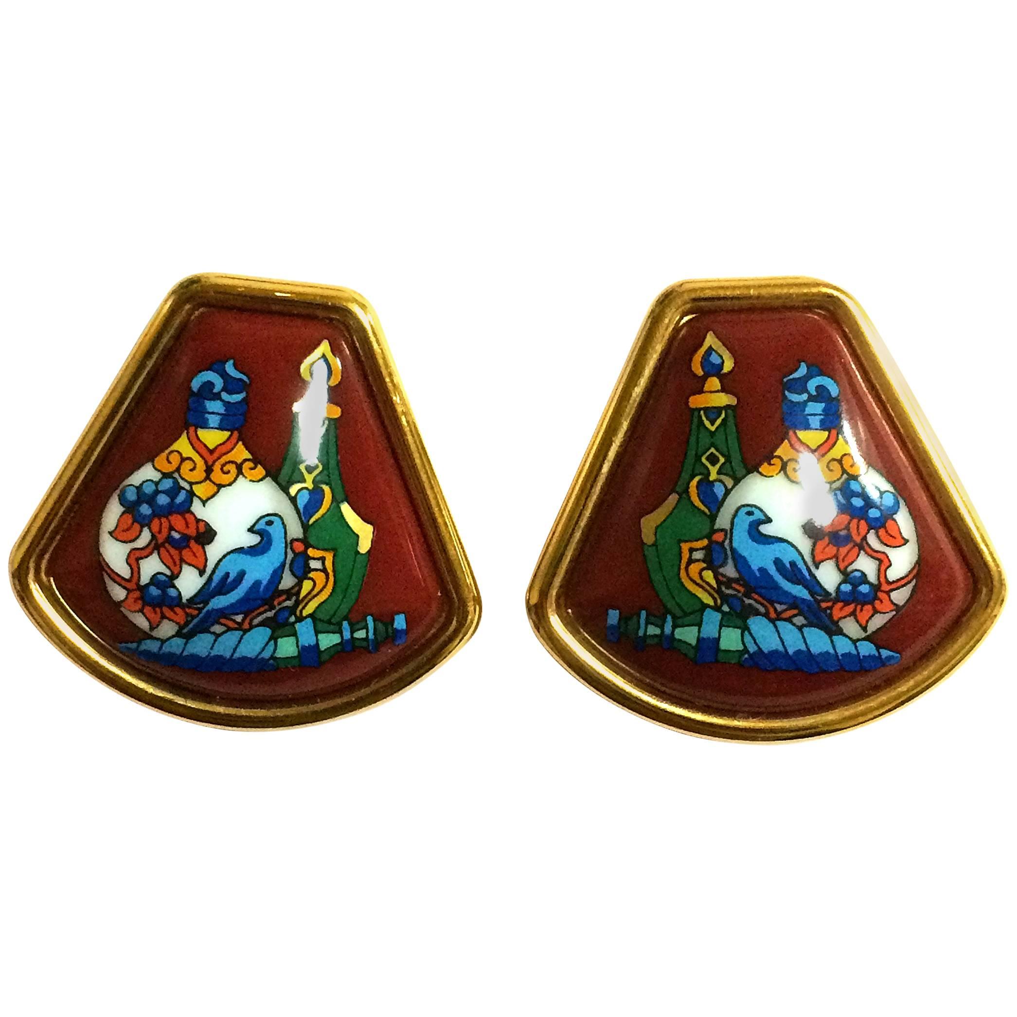 Vintage Hermes cloisonne golden earrings with colorful perfume bottle design.