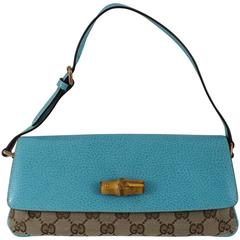 Gucci Turquoise leather and Monogram Canvas Clutch