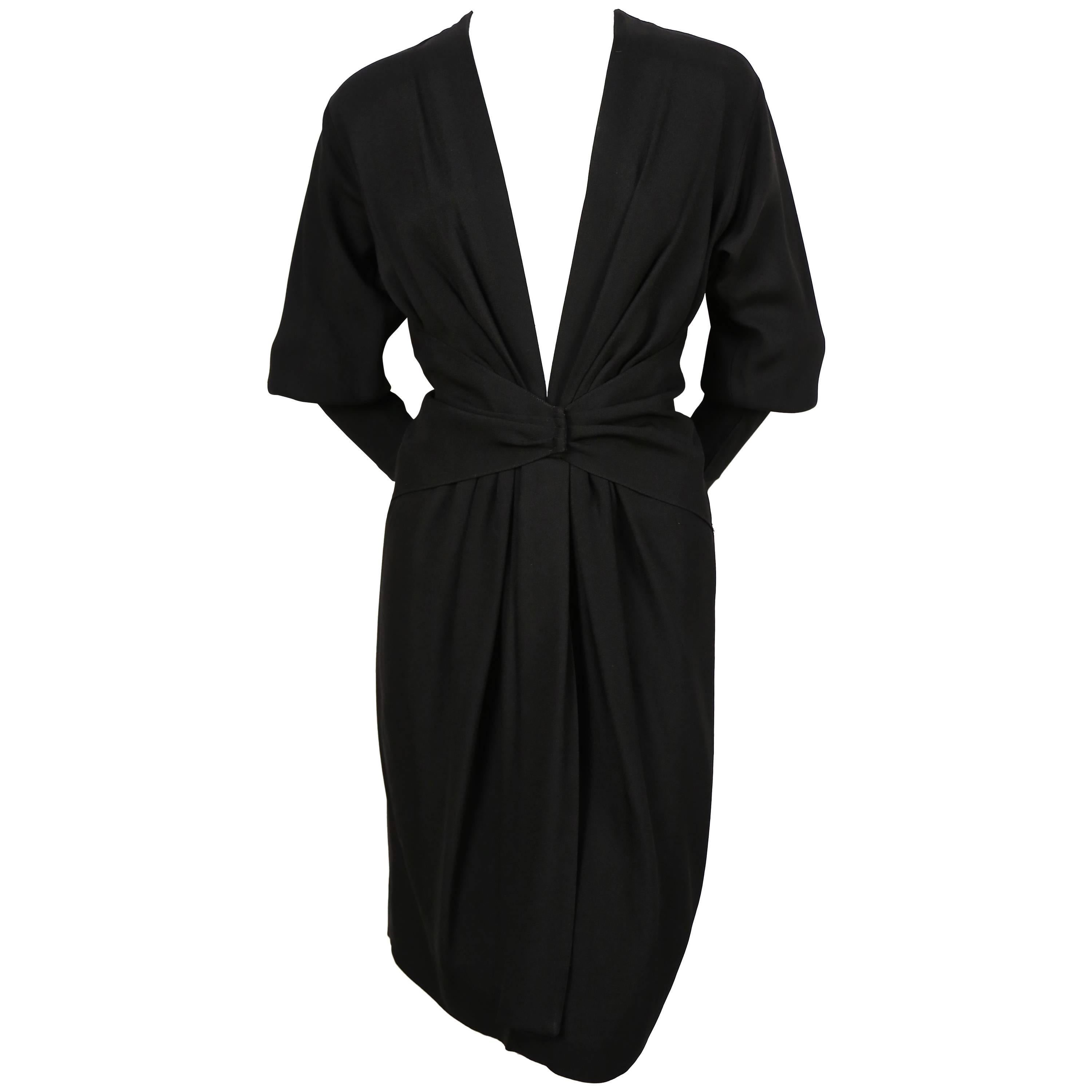 1970's SAINT LAURENT black dress with plunging neckline and draped 
