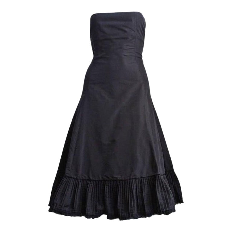 2003 ALEXANDER MCQUEEN black taffeta dress with pleated hemline trimmed in fur For Sale