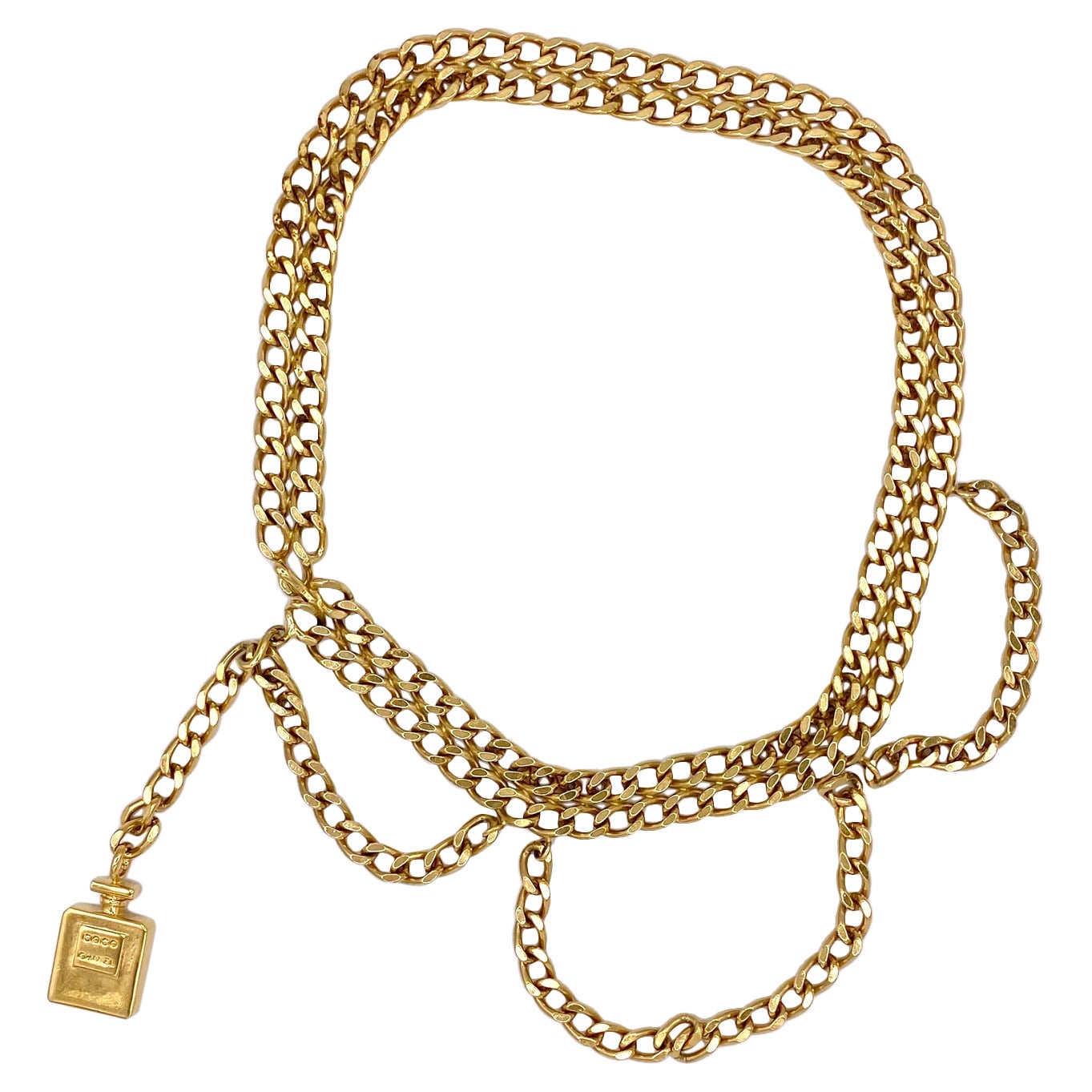 Vintage chain belt, draped with Chanel perfume bottle