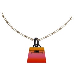 Hermès Collier Fusion Amulette Kelly pendentif en acidule et quincaillerie Permabrass