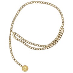 Vintage Chanel golden link chain belt with the rue Cambon Paris medallion.