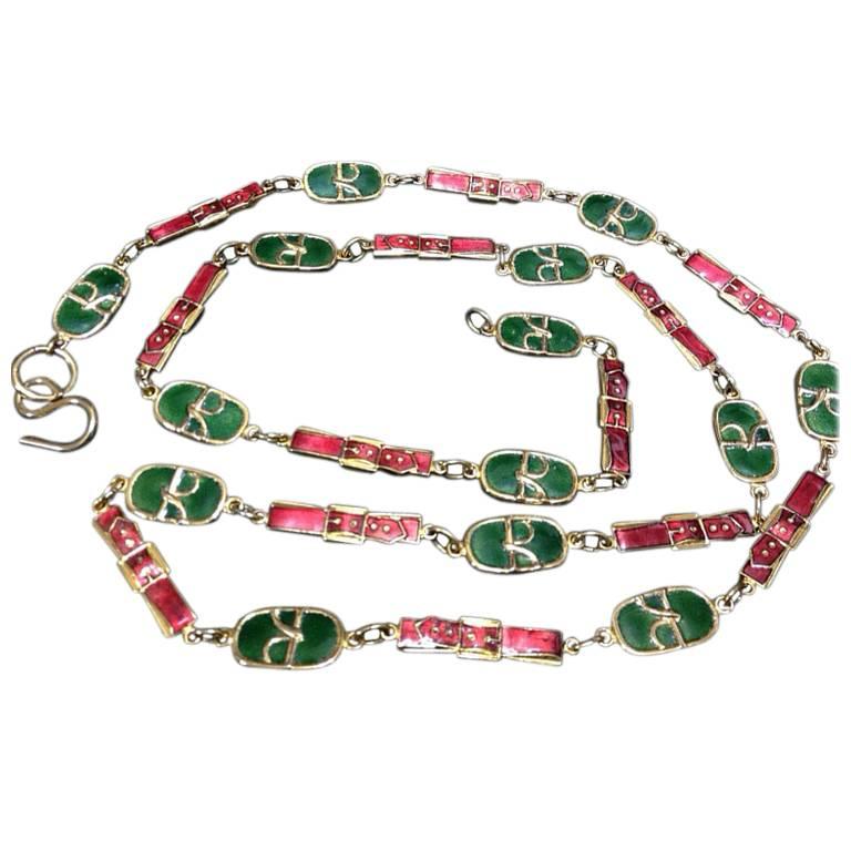 Vintage Roberta di Camerino red orange and green charm golden necklace and belt.