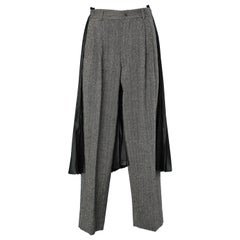 Mix tweed pants and black pleated skirt Comme de Garçons