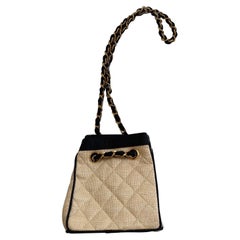 CHANEL two tone raffia and leather bucket bag