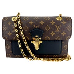 LOUIS VUITTON Victoire  Sac à main en cuir noir Monogram 