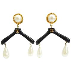 Vintage CHANEL black hanger design dangle earrings with teardrop faux pearls.