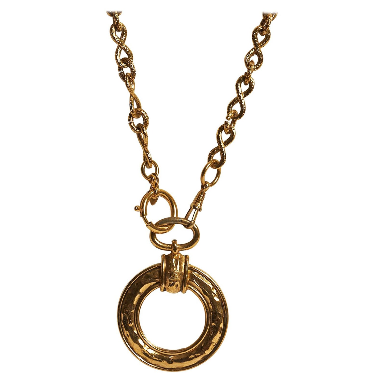 1980s Chanel hammered gold tone fancy chain magnifier necklace. Can be worn single or double. Comes with original duster or box. Pendant: Diameter 2