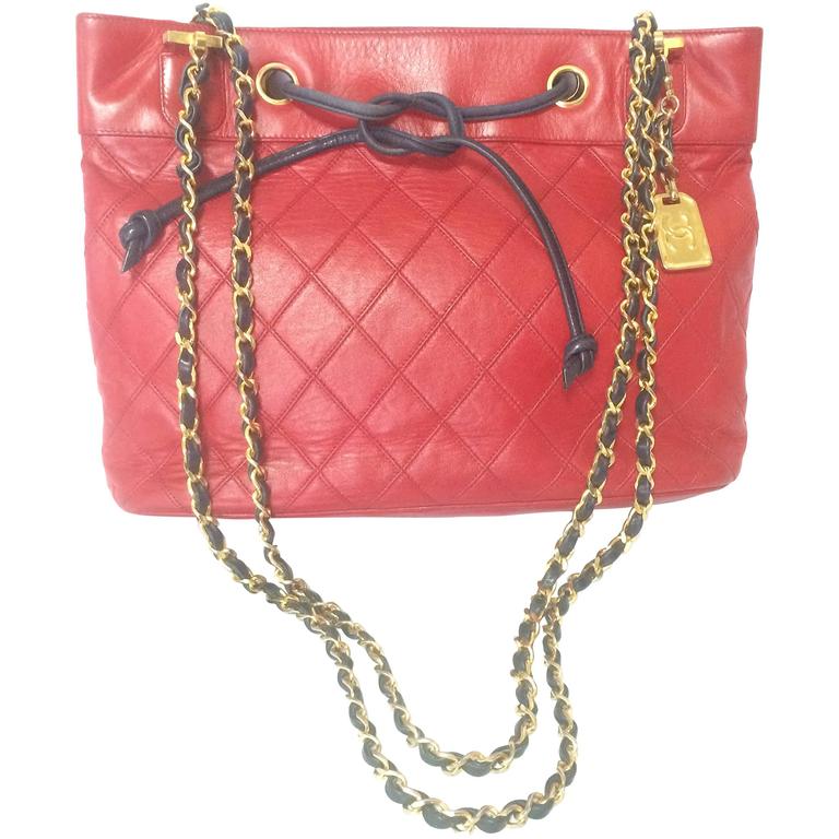 Vintage CHANEL classic tote bag in red leather with golden chain and