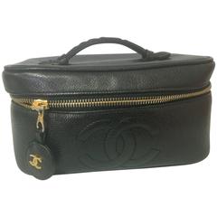 Retro CHANEL caviarskin cosmetic and toiletry black purse. Classic vanity bag.