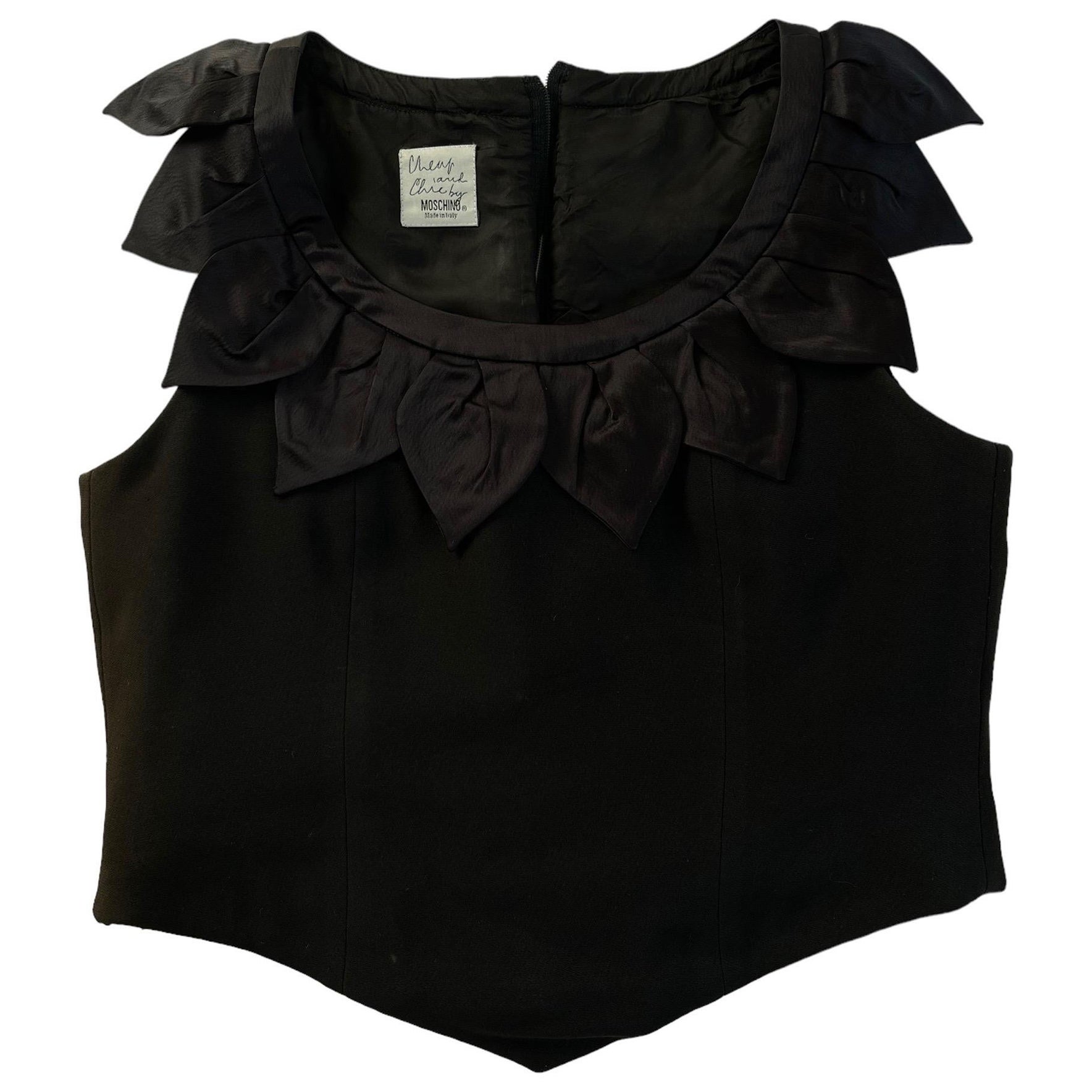 Vintage Moschino Cheap and Chic Petals Corset Top
Black with cute petal bust detail. 
Devine. 

size and fabric composite tags have been removed. 
Our estimate of fit UK 8-10 please see measurements 
Pictured on size 6 5’5   
approx measurements in