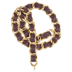 Cintura a catena in pelle color oro e prugna di Chanel