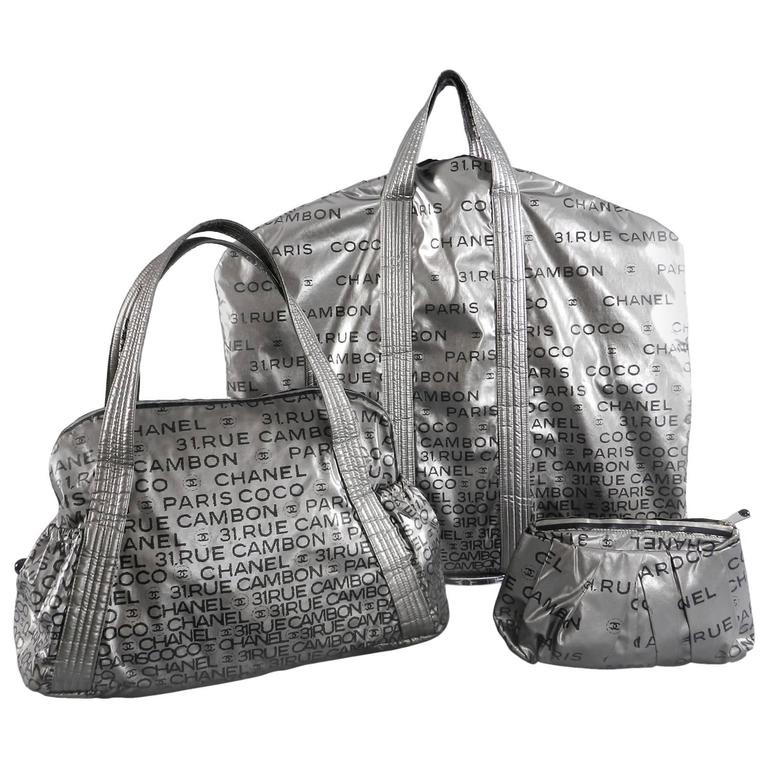 Chanel 2009 Unlimited Silver 3pc Travel Set - Garment bag, purse, makeup at  1stDibs
