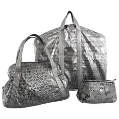 Chanel 2009 Unlimited Silver 3pc Travel Set - Garment bag, purse, makeup