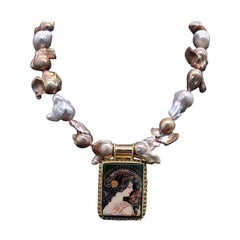 A.Jeschel Glamorous Baroque Pearl with an Art Deco miniature pendant.