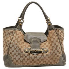 Gucci - Grand sac à bandoulière en cuir et toile GG gris/beige, état neuf