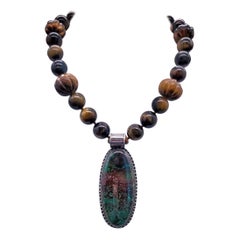 A.Jeschel A Powerful single strand Tiger Eye necklace with Chrysocolla Pendant.