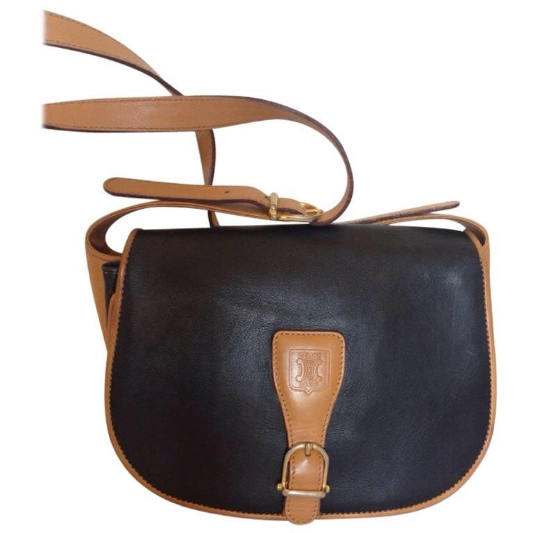 Vintage Celine black and brown genuine leather shoulder bag with logo embossed.