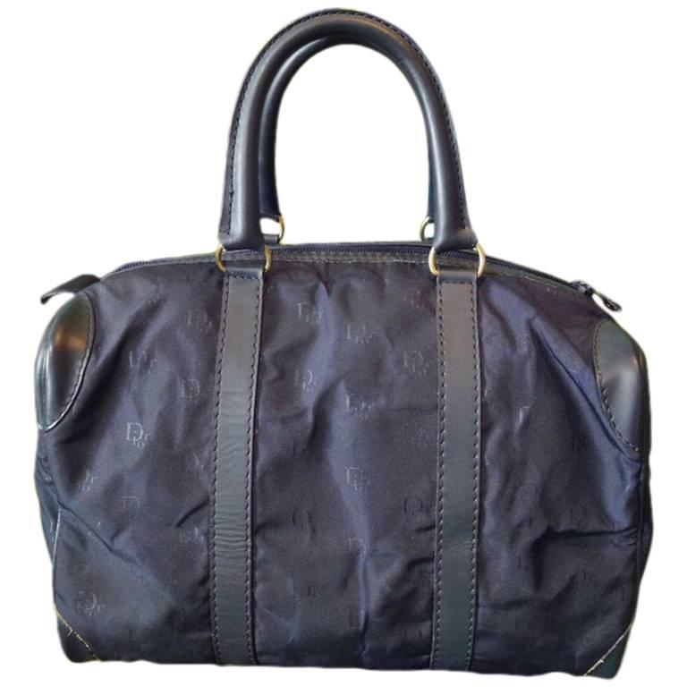 Vintage Christian Dior navy bag in nylon logo jacquard and leather handles. For Sale