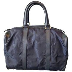 Retro Christian Dior navy bag in nylon logo jacquard and leather handles.