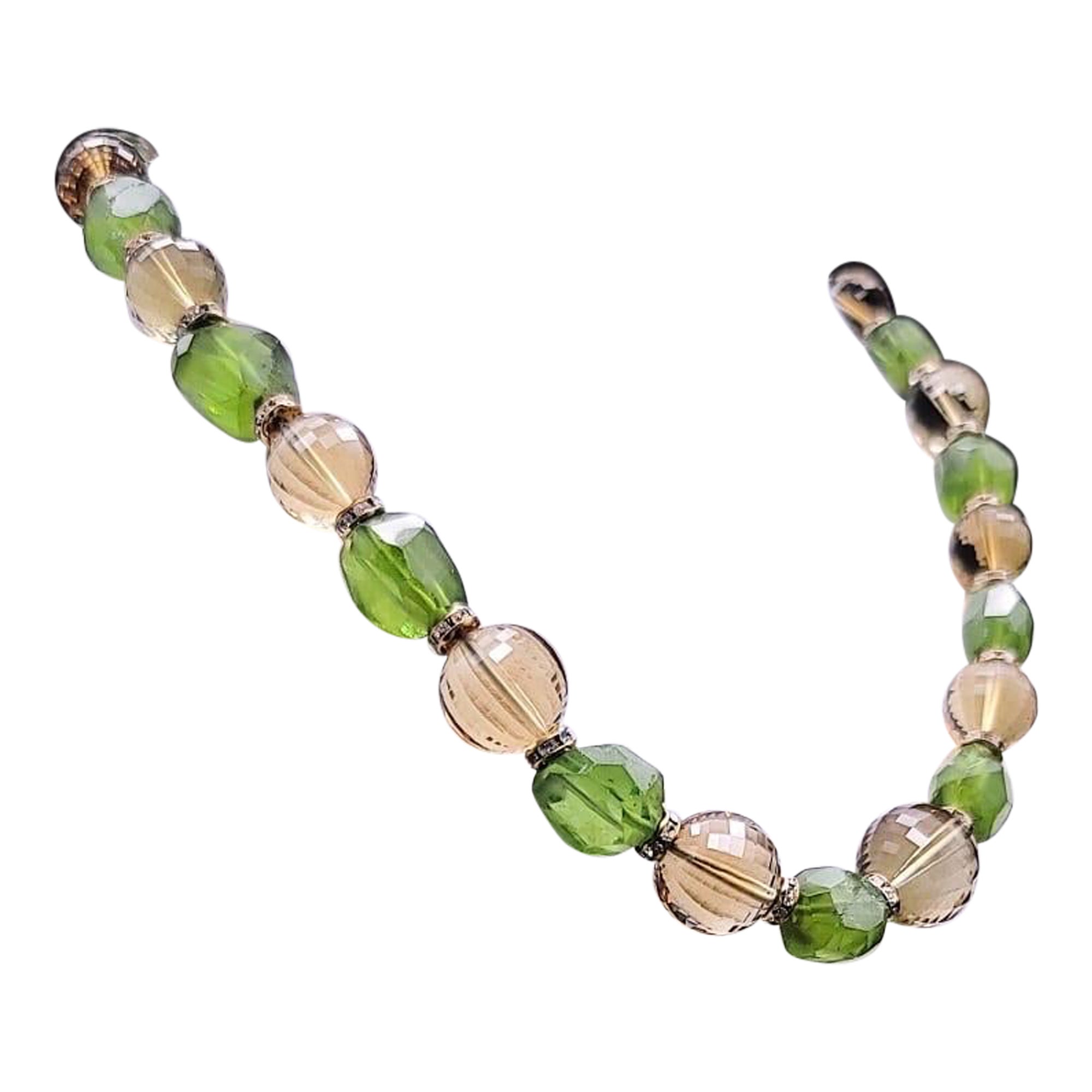 One-of-a-Kind
Discover the extraordinary beauty of this one-of-a-kind necklace, a true testament to nature's splendor. Unusually large faceted Peridot nuggets and captivating faceted Citrine gemstones alternate gracefully along a single strand,
