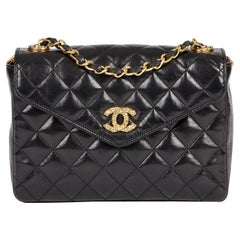 CHANEL Borsa Mini Flap in pelle d'agnello trapuntata nera impreziosita da cristalli