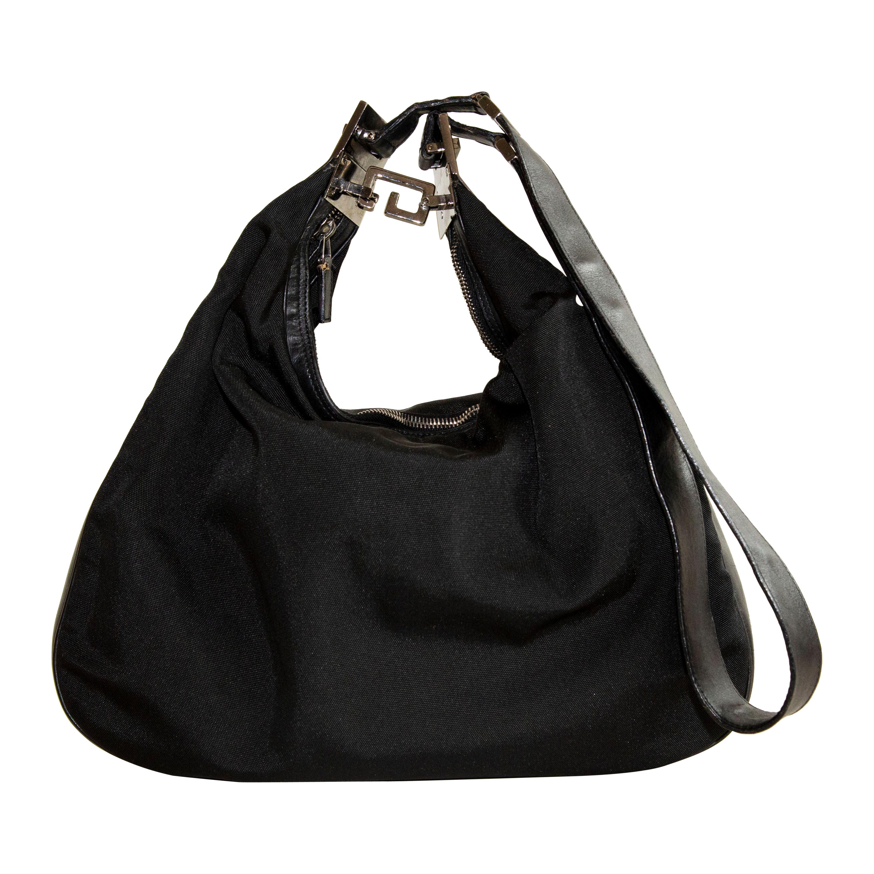 Attache large textured leather-trimmed coated-canvas shoulder bag