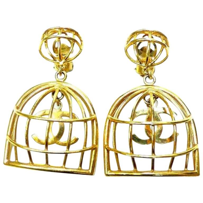 Vintage CHANEL gold tone bird cage design dangle earrings with CC mark.Rare  For Sale