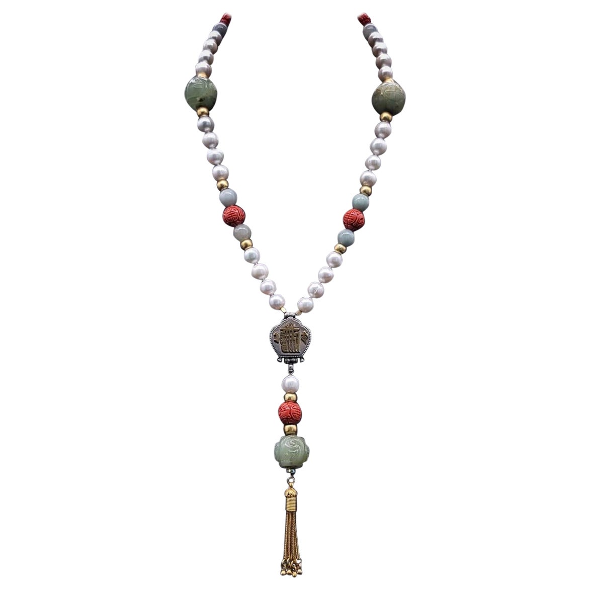 A.Jeschel Long Pearl necklace with Jade carved beads.