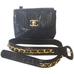 Retro CHANEL black leather waist purse, fanny bag with golden chain belt.