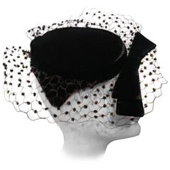 1950s Black Velvet Cocktail Hat with Bow and Chenille Dotted Veiling