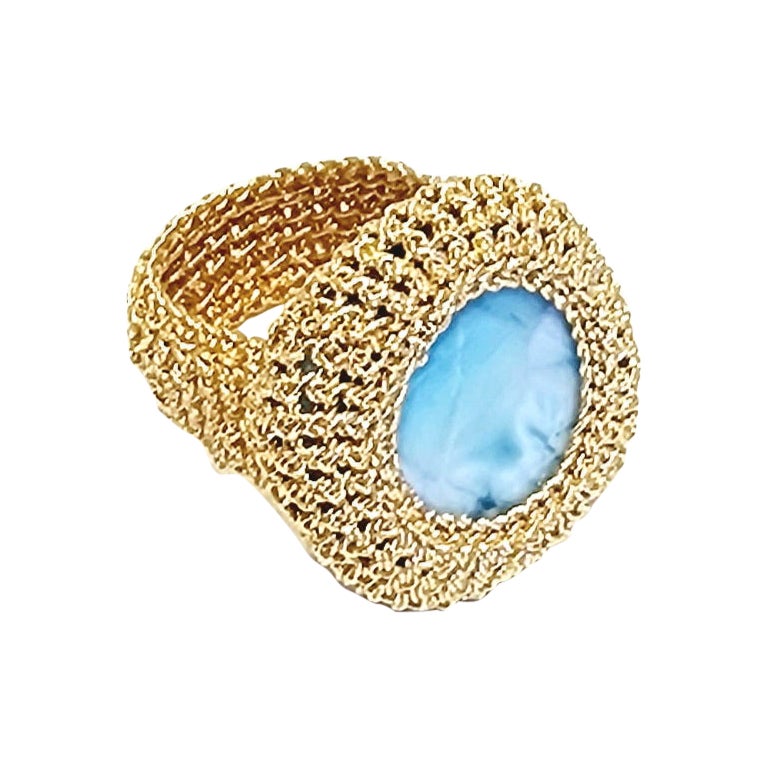 Unique, one of a kind, hand crochet cocktail ring with a natural square shaped Larimar, measuring 25 mm x 25mm. Stone is crochet into place with an 18 karat gold thread wire, flattened and wrapped around a cotton core. Weight of ring 22 grams. Base