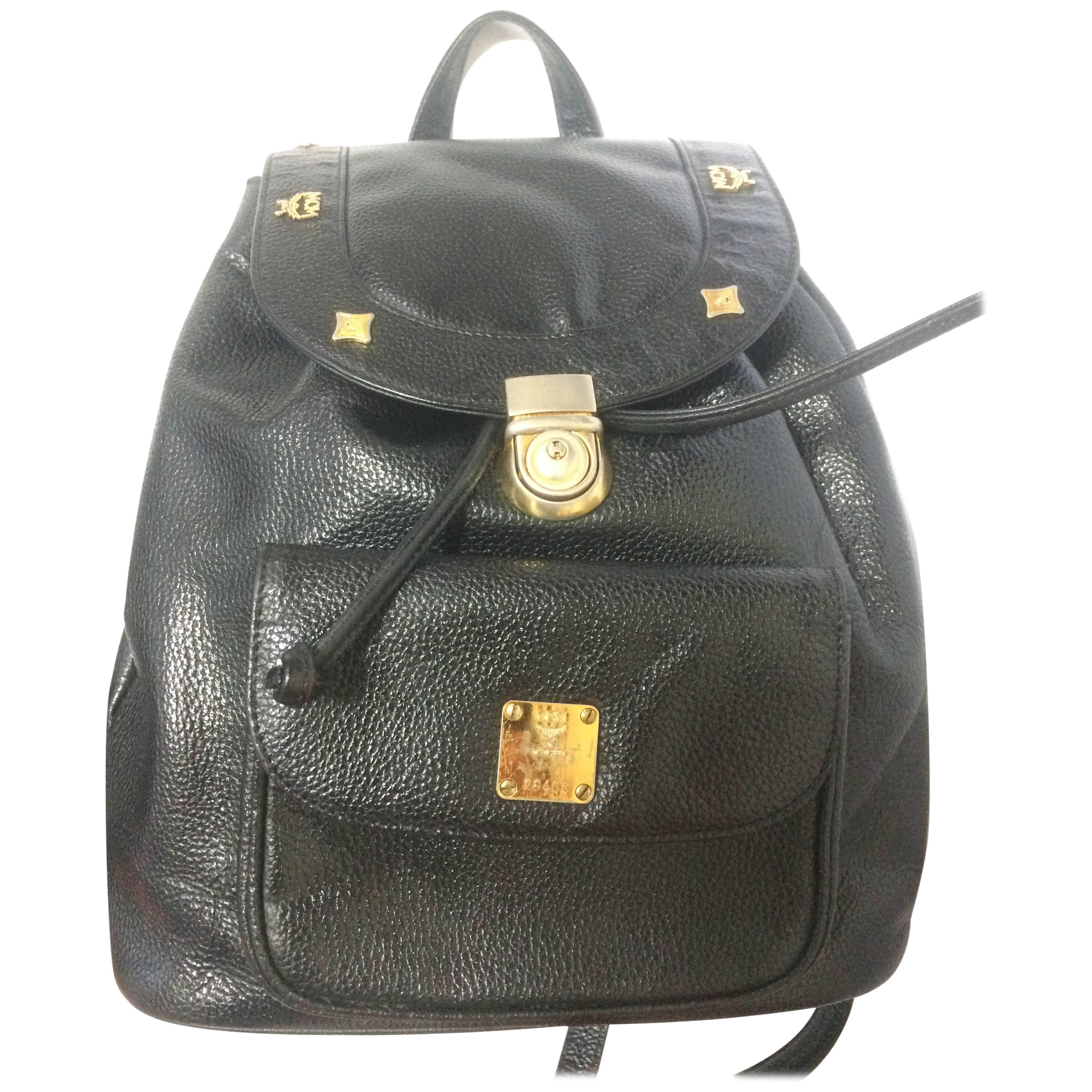 Vintage MCM genuine leather black backpack with logo motifs, By Michael Cromer.
