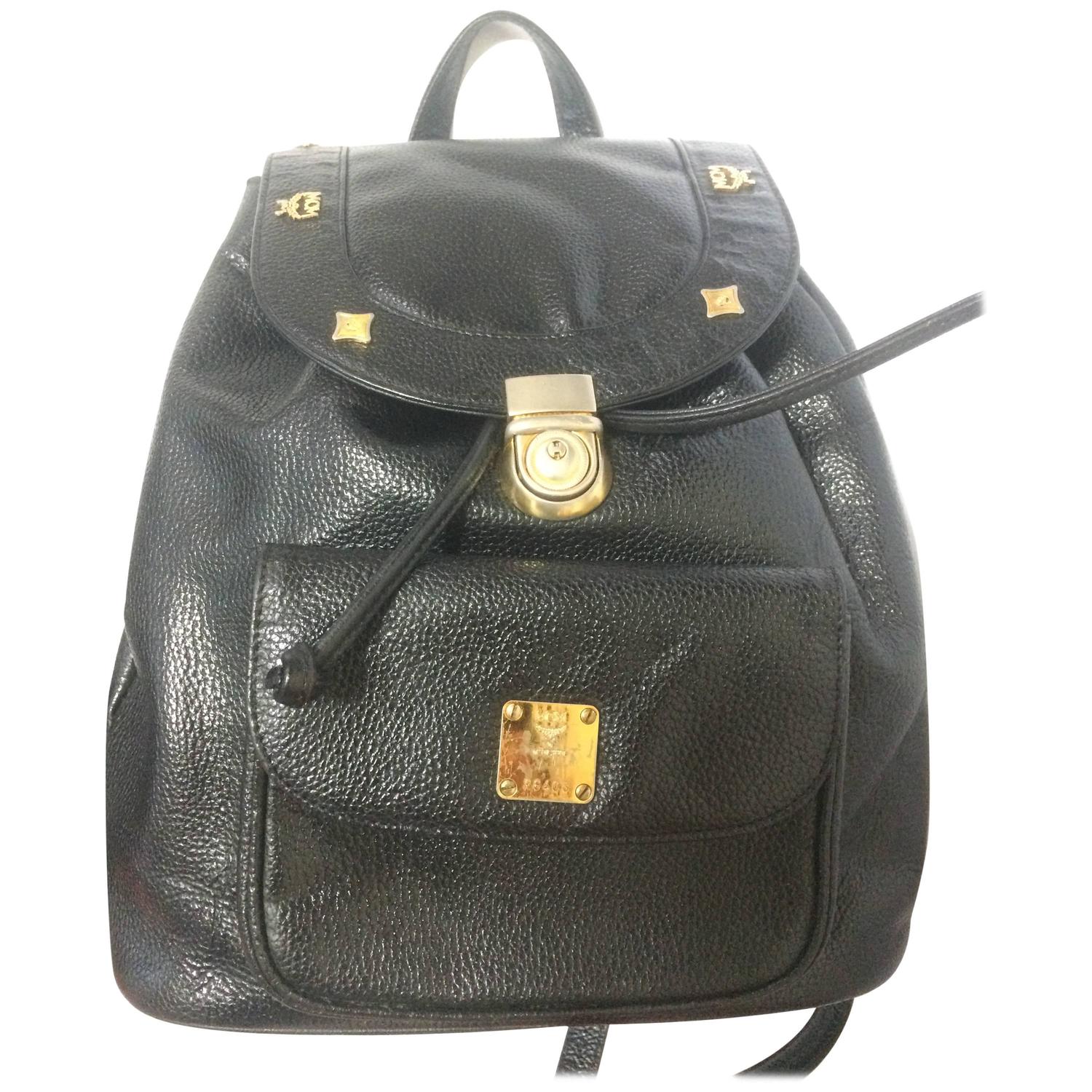 Vintage MCM Black Backpack With Golden Studded Logo Motifs and 