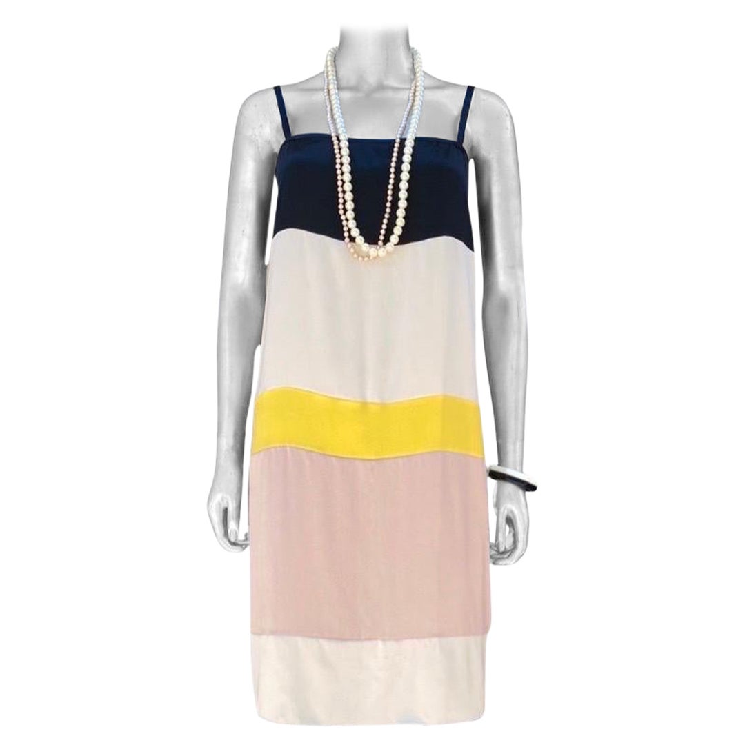 This beautiful French dress by Vionnet Paris is a perfect Spring/Summer 2023 vacation or party dress. Purchased in Paris, it is as new and never worn since purchased. Modern chic color-blocking in the unusual French way. Black, Creme, Blush pink and