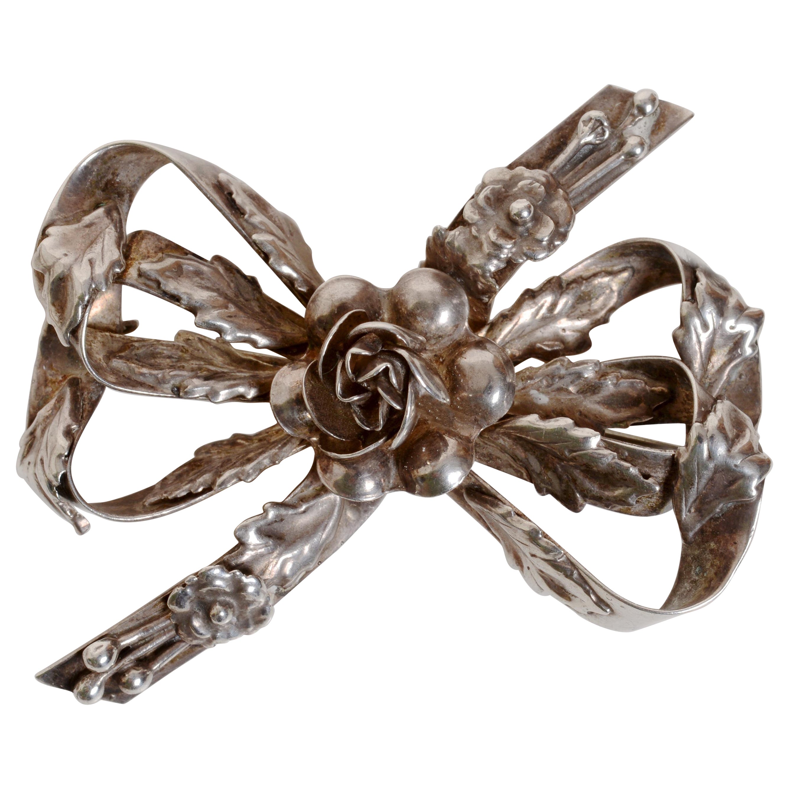   Classic Sterling Silver Brooch Ribbon and Flower Design, c1942, Signed Hobé For Sale
