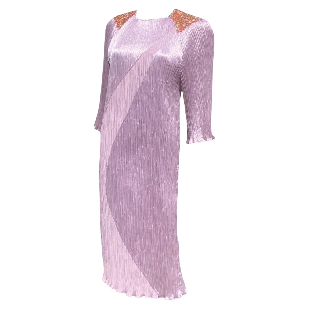 A very chic dress made by American, New York, designer Morton Myles for the Warrens. This beauty has resided in a Palm Springs Fashionistas closet since it was new. A gorgeous spring color of light lavender with gold iridescent sequins embroidered