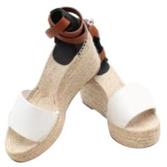 Hermes - Chaussures compensées Tipoli en cuir et jute de couleur crème