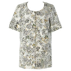 Veste d'été en coton blanc découpé au laser et orné de fleurs Chanel 