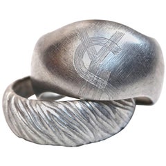 Used 1980's YVES SAINT LAURENT set of brushed silver cuff bracelets
