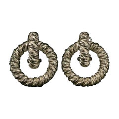Hermès - Boucles d'oreilles à clip en métal argenté