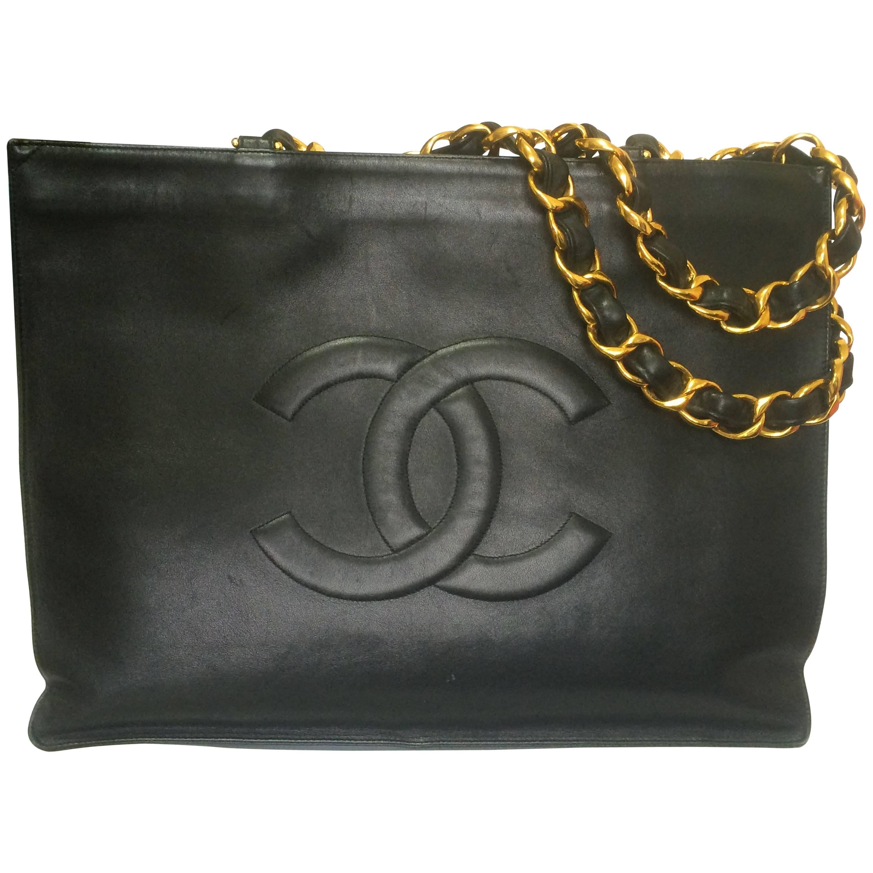 Vintage CHANEL black calfskin large tote bag with gold tone chain handles and CC