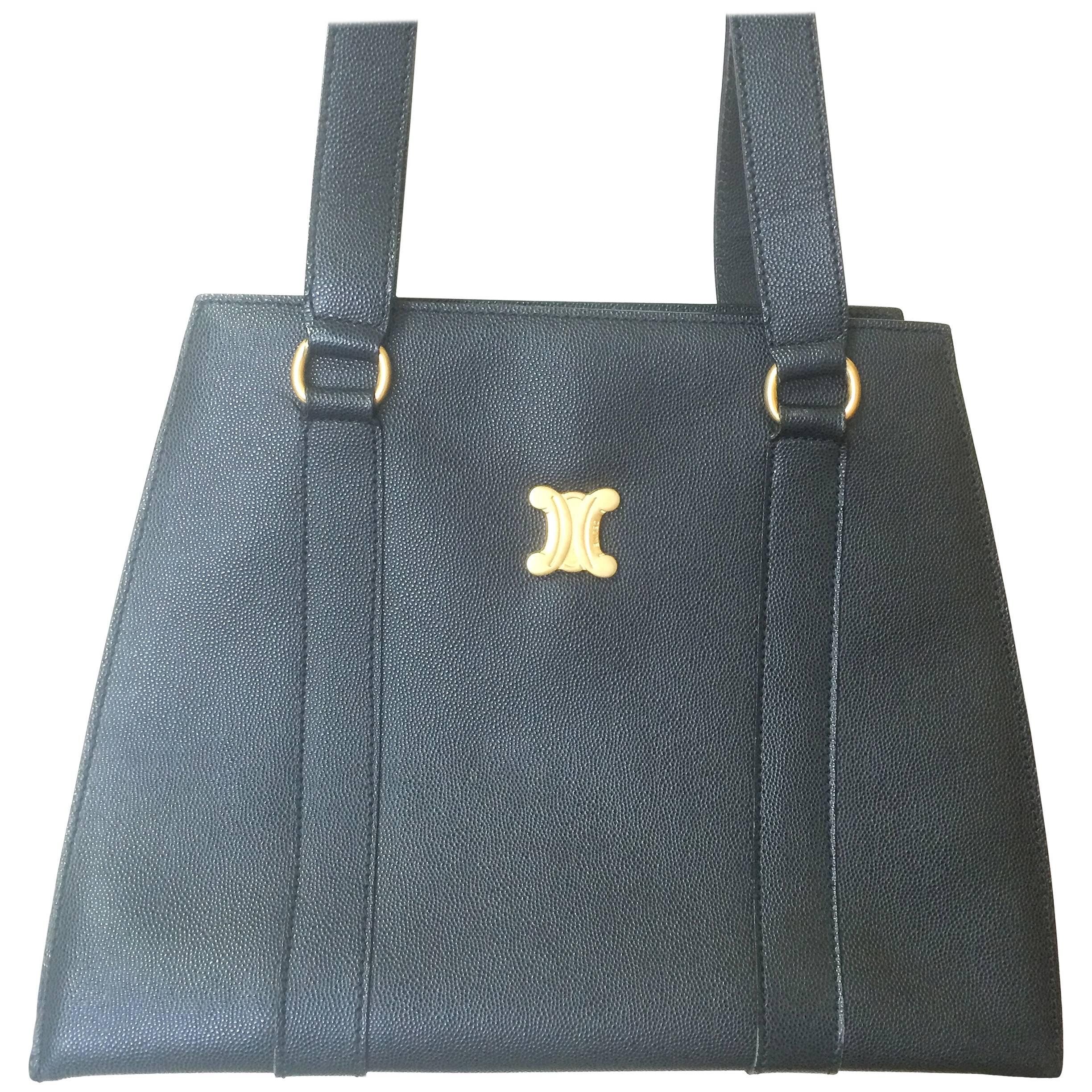 Vintage CELINE black trapezoidal tote with red lining and gold tone Celine logo